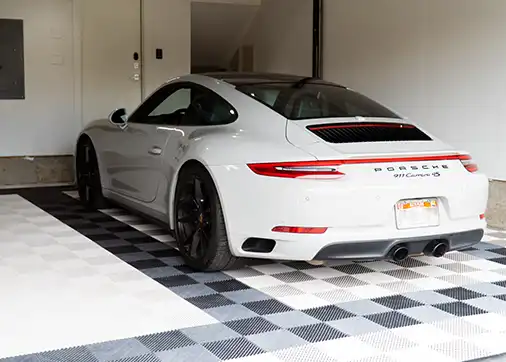 The floor is complete and Porsche is parked in the garage.